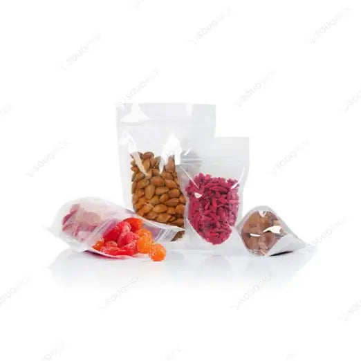 Clear zipper pouch with assorted snacks on a white background